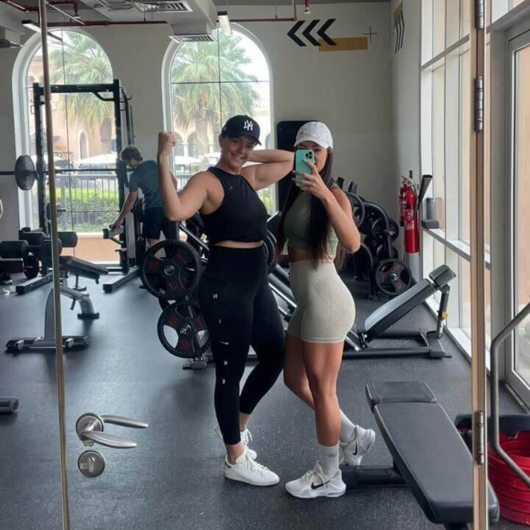 Elena and her client taking a selfie after shoulder workout at the gym
