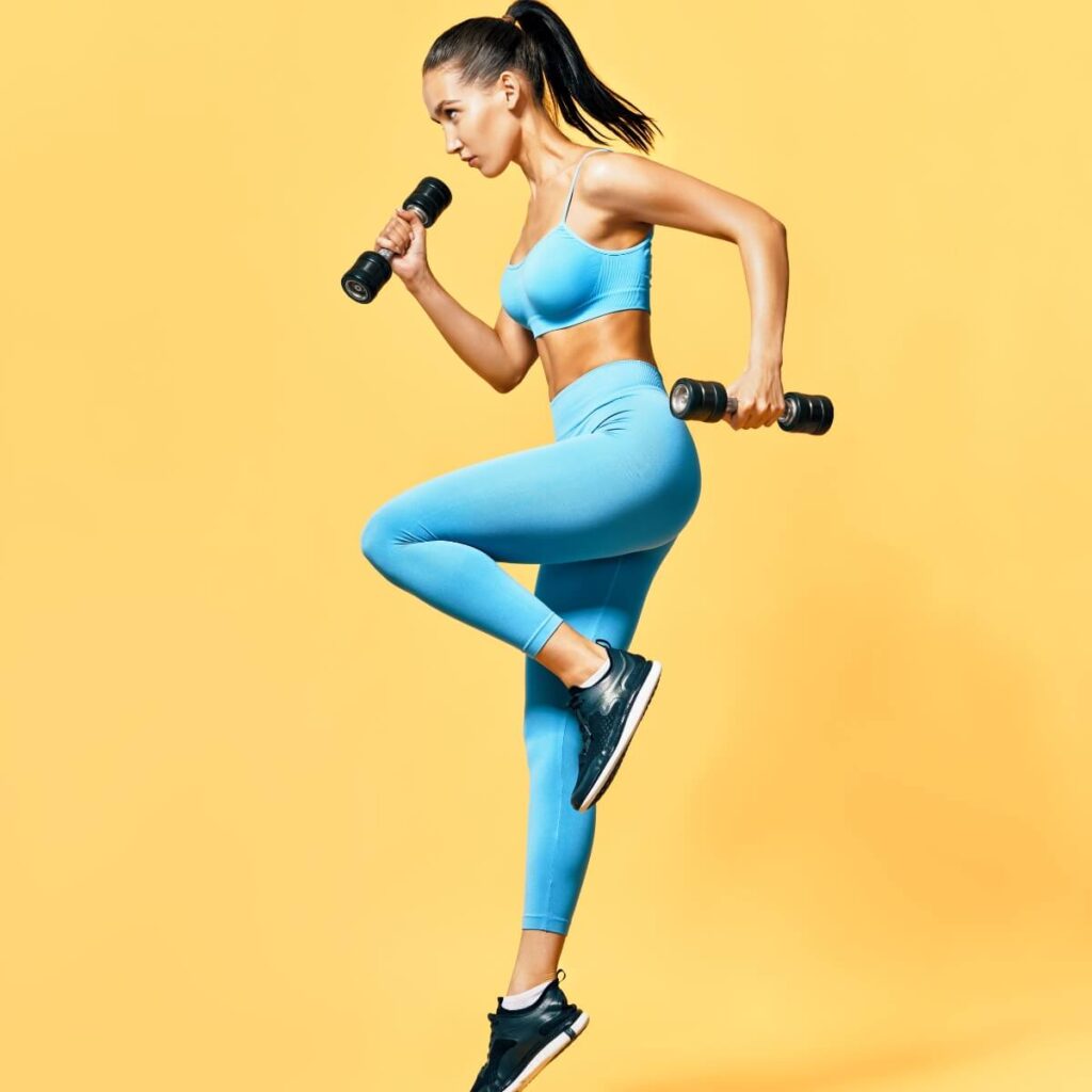 Fitness enthusiast demonstrating a lunge with dumbbells, showcasing the balance between Classic Workouts and Modern Fitness trends.