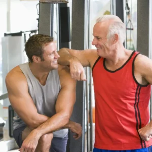 Two Men Over 40 Working Out in the Gym