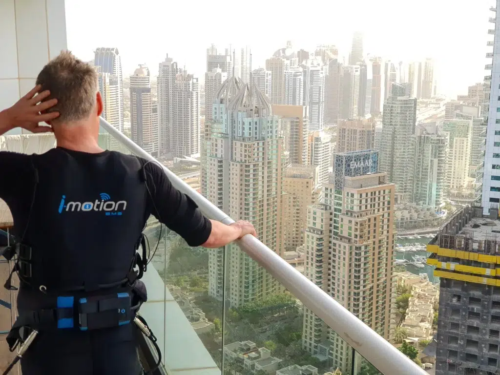 TrainWithUs EMS Personal Trainer Andre Working Out on the balcony in Dubai Marina