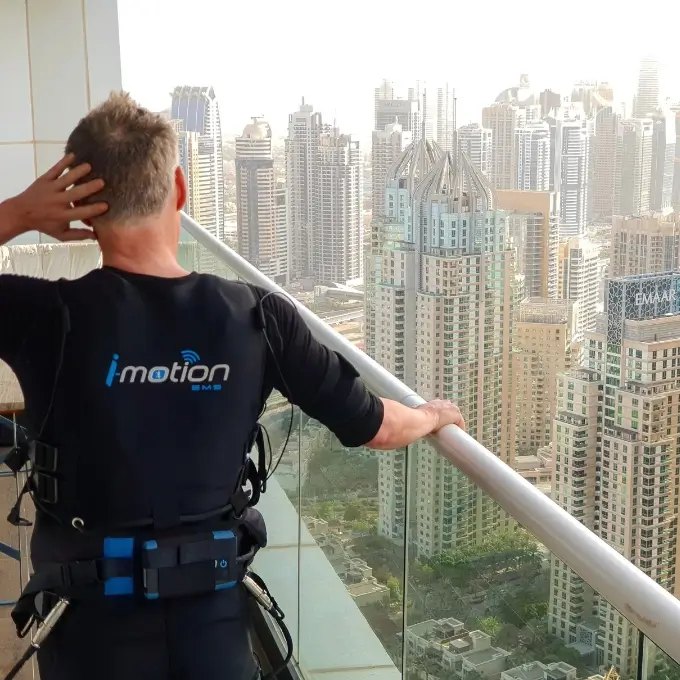 TrainWithUs EMS Personal Trainer Andre training on his balcony in Dubai Marina