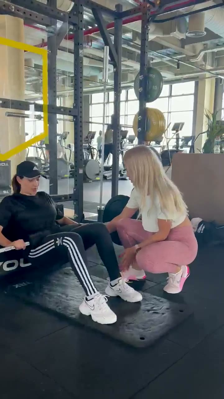 Jovana coaching a client through hip thrusts in Dubai