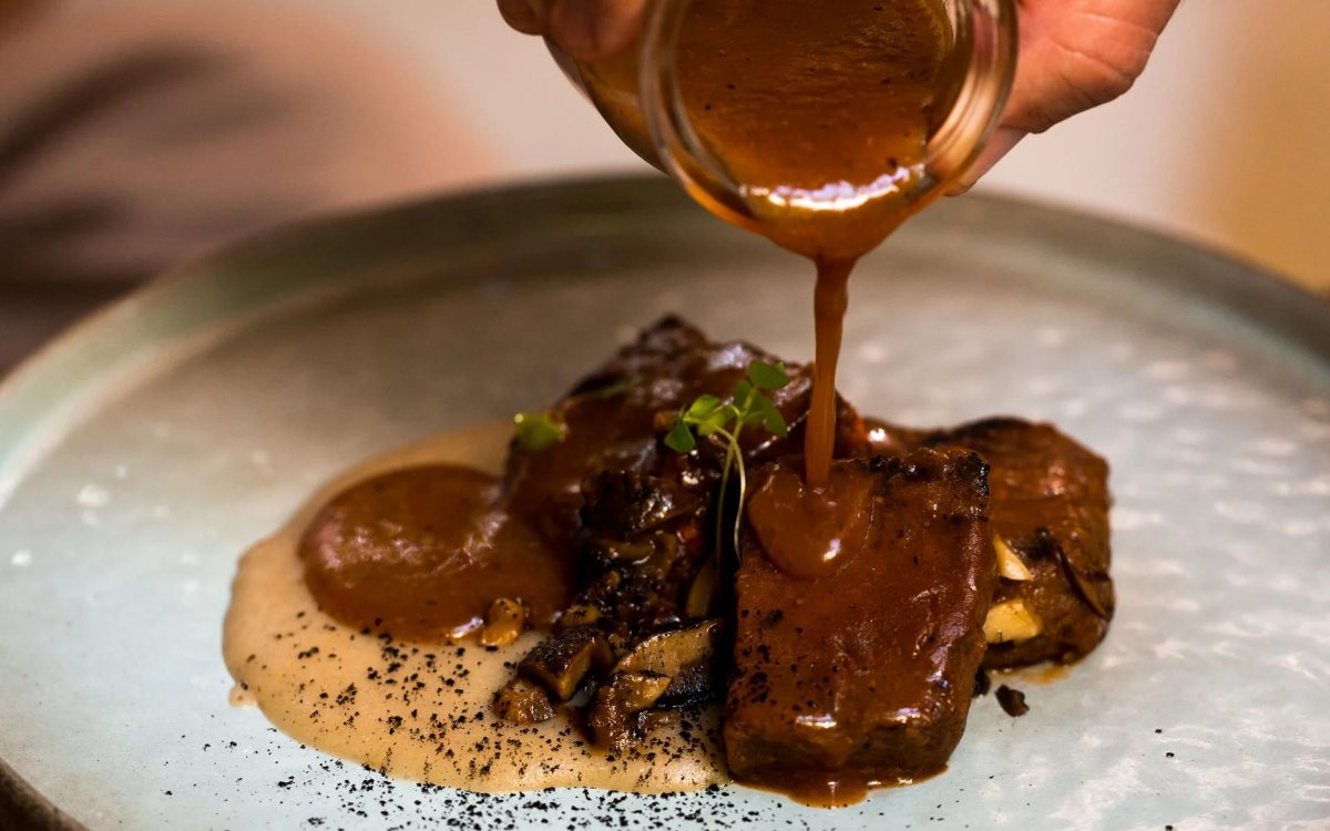 A plant based main being plated at SEVA Table in Jumeirah