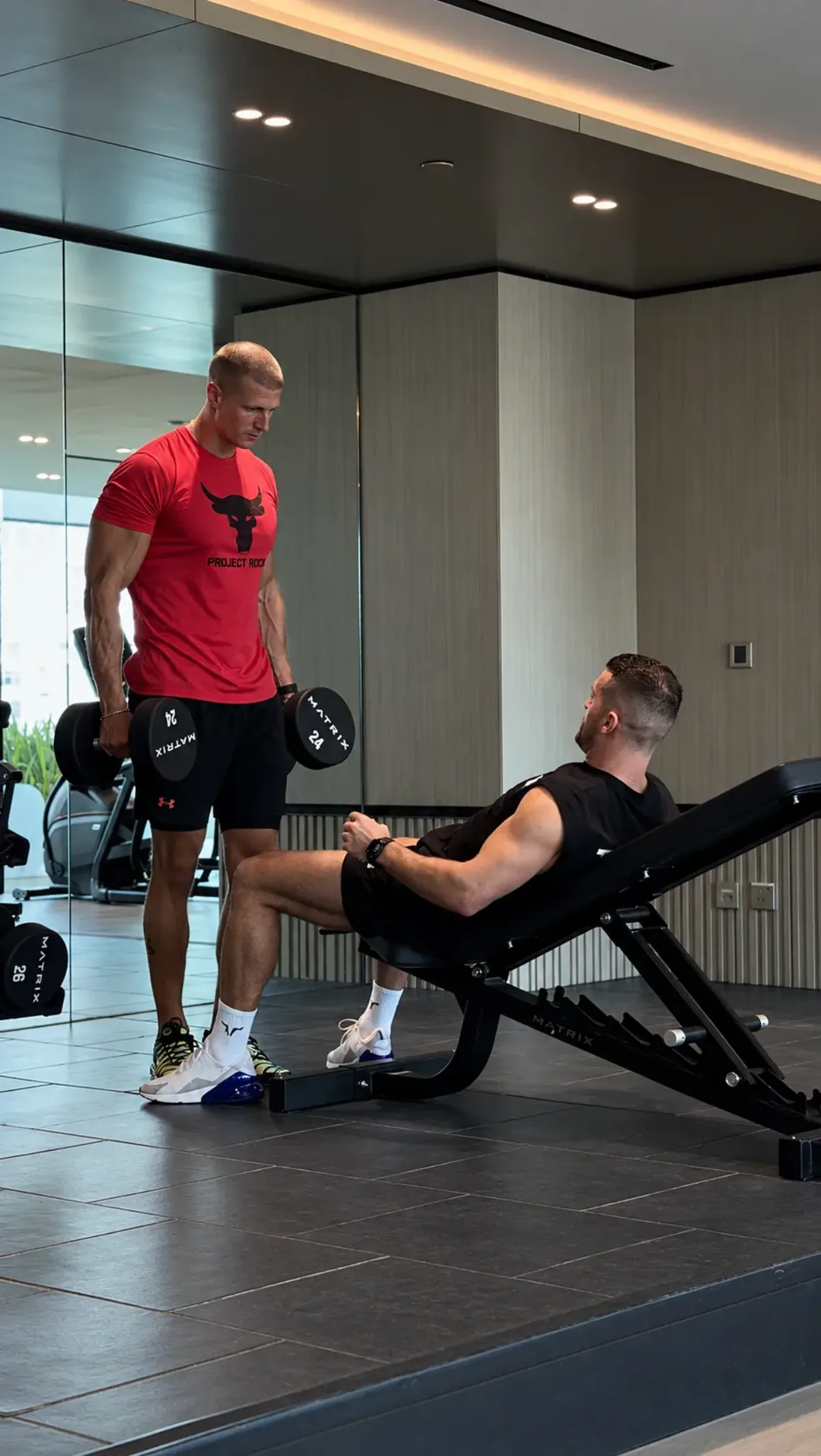 Mike training with weights in a Dubai gym
